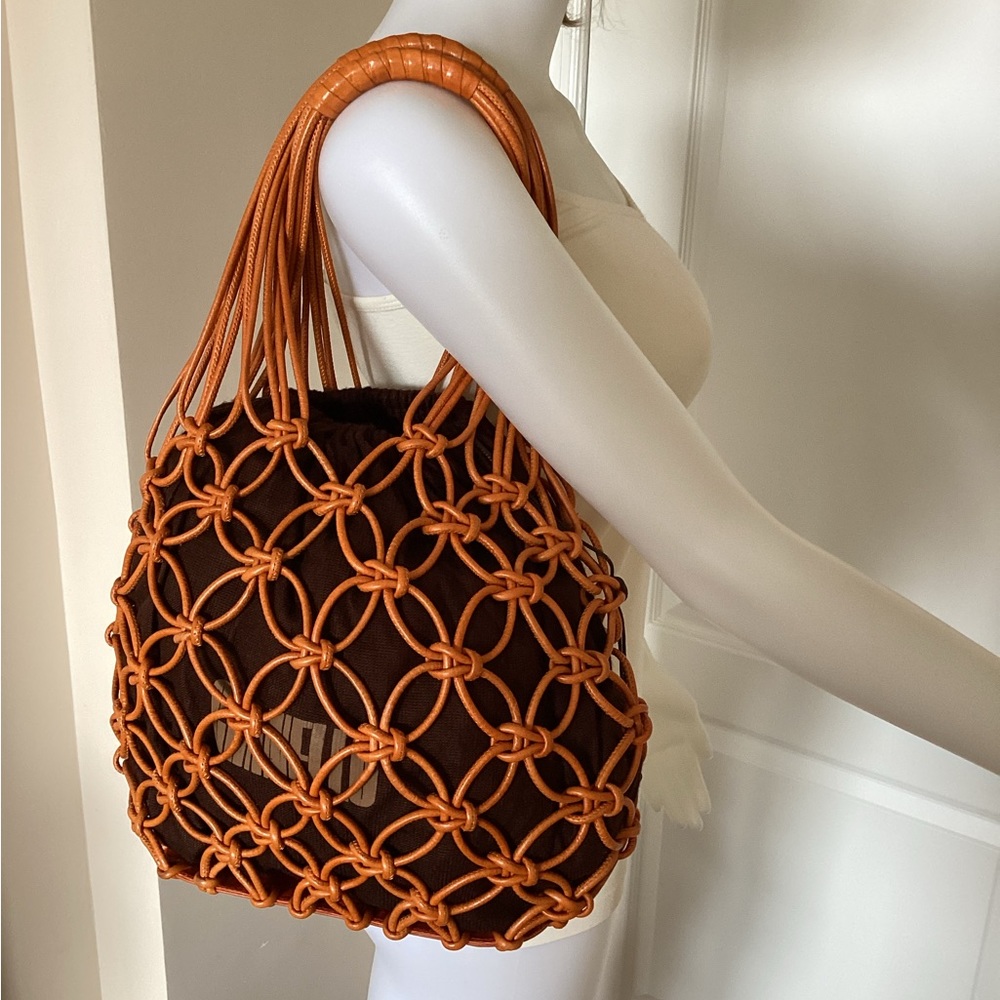 Leather woven mesh handle bag.